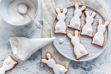 Glazed Easter cookies in the form of bunnies. - obrazy, fototapety, plakaty