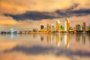 Golden sunset over San Diego California skyline with reflections in the bay