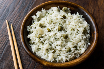 Cooked Plain Basmati Rice with Dill and Green Peas / Pilav or Pilaf Served with Chopsticks.