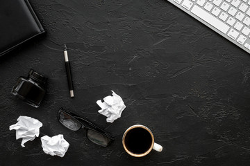 writer workplace with tools for work on black table background top view mockup