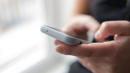 phone in female hands close-up. Millenial modern life