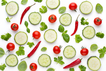 Vegetable and spices isolated on white background, top view. Wallpaper abstract composition of vegetables.