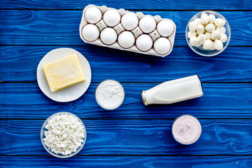 Breakfast on farm with dairy products. Milk, cottage, cheese, yougurt on blue table top view