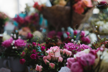 Beautiful and modern floral composition with pink roses and eucalyptus at the city flower market
