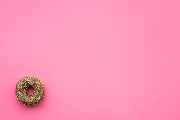 Sweet tasty snack. Glazed donut on pink background top view copy space