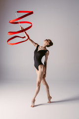 Young gymnast woman stretching and training