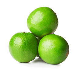 heap of ripe green limes isolated on white background