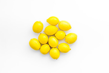yellow lemons on white background top view mock up