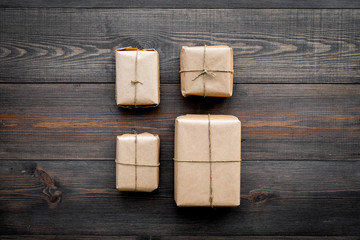 Parcels box in delivery service office wooden background top view space for text