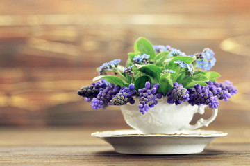 Mothers Day card with blue muscari flowers in vintage teacup