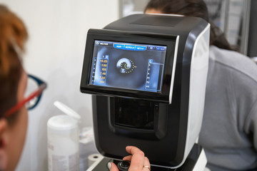 Ophthalmology eyesight diagnostic concept. Modern eye test machine equipment in clinic