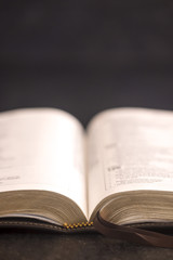 Open Bible on a Slate Tabletop with Customizable Space to Add Text