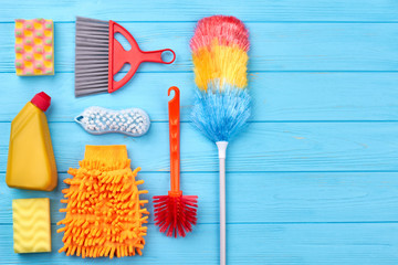 Flat lay cleaning products, copy space. Set of equipmet for house cleaning including brushes,...