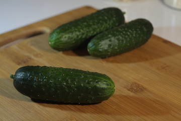 cucumbers on wooden table