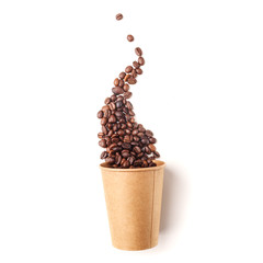 Cardboard cup filled with coffee beans. Isolated.