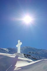 Cross christian symbol made from a block of ice on top of the ice church at Balea lake in Sibiu...