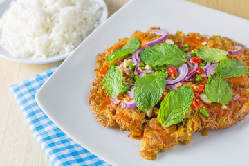 canned fish omelette and rice on table, thai food