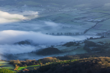 Between Basque mountains dawning in the fog, Spain