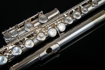 Naklejka premium Close up of the silver plated musical instrument flute