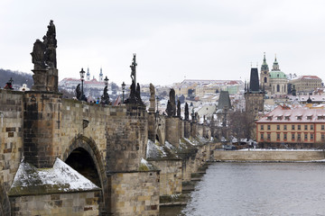 Fototapeta na wymiar Snowy Prague Lesser Town with St. Nicholas' Cathedral, Czech republic