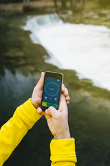 Woman using a running App in smartphone