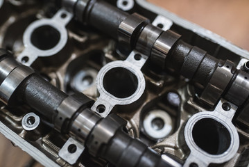 Motor head, valve, cam-shaft, from a motorcycle or car. Close-up shot 
