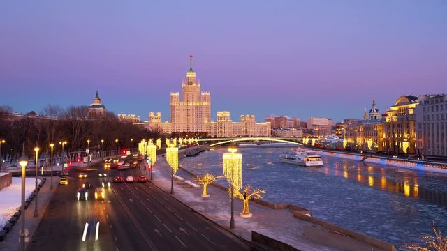 Moscow, Russia. Sunset over famous landmarks - Kotelnicheskaya Embankment Building - Stalinist skyscraper. Time-lapse with car traffic in the capital of Russia. Bridges over Moscow river