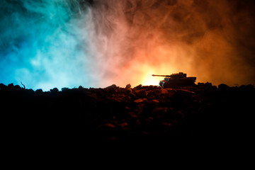 War Concept. Military silhouettes fighting scene on war fog sky background, World War German Tanks Silhouettes Below Cloudy Skyline At night. Attack scene. Armored vehicles. Tanks battle. Close up