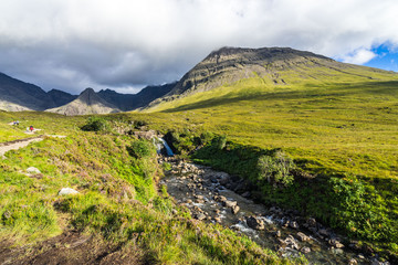 Landscape with River Brittle descending from Fairy Pools and Cuillin mountains, Isle of Skye, Scotland, Britain