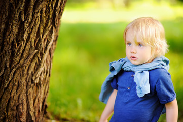 Portrait of little boy during stroll in the forest