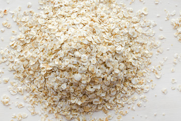 heap of oat flakes on a white background