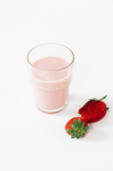 Glass with typical Austrian and Scandinavian strawberry flavored drinking yogurt, milk or smoothie on white background