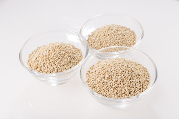 Quinoa grains in bowl isolated on white background, Chenopodium quinoa