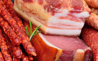 Sausages, smoked bacon with prosciutto crudo and salami