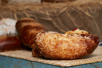 Russian homemade pie, loaf cake with nuts on rustic wooden table background, close-up. Delicious russian national dessert sweet pastry