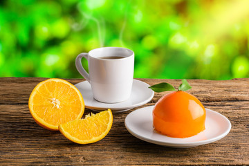 Orange cake on grunge wooden table