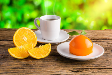Orange cake on grunge wooden table