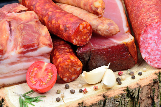 Variety types of sausages on a wood board