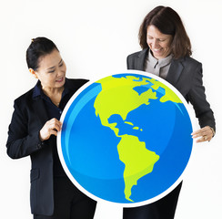 Businesswomen holding globe icon