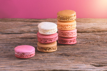 Different types color of macaroons on Old grunge wooden background