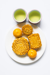 Moon cake and tea for Chinese mid autumn festival. Isolated on white. Copy space
