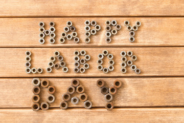 Labor day.  Different tools on a wooden table