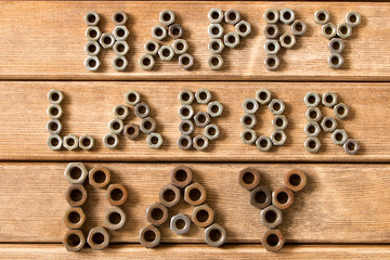 Labor day.  Different tools on a wooden table