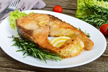 Big roasted carp steak with lemon and rosemary.