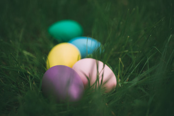 Colorful eggs on fresh springtime grass