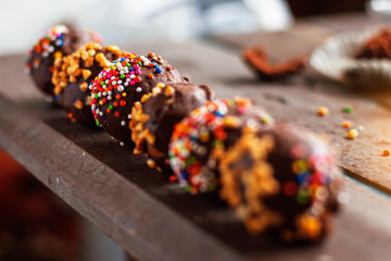 Chocolate of colorful on wooden.