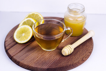 tea cup, honey jar and lemon