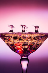Liquid Drop Art Of Three Umbrellas