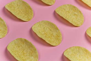top view chips pattern pink pastel background