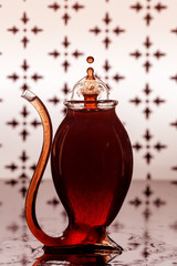 A Water Drop Shape Within A bubble Created With Wine In A Port Glass